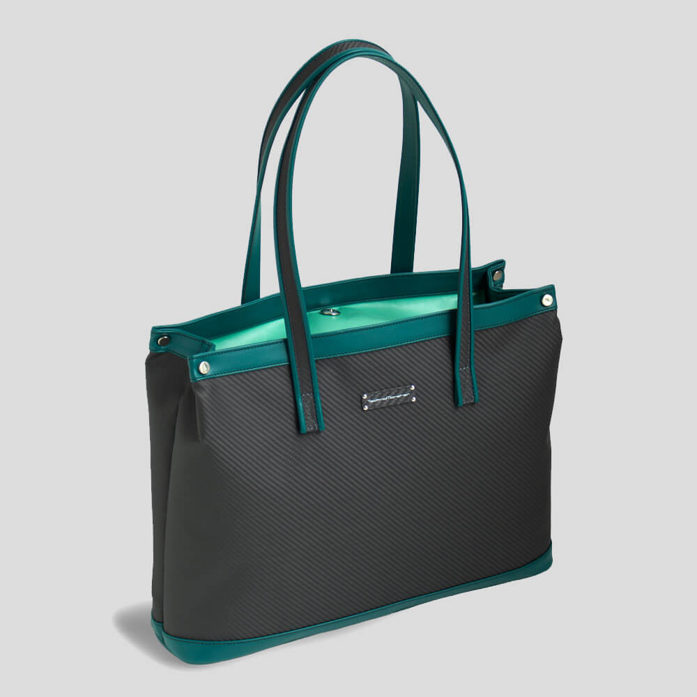 A stylish deep teal tote bag with soft carbon fiber material and contrasting teal accents, featuring two sturdy handles.